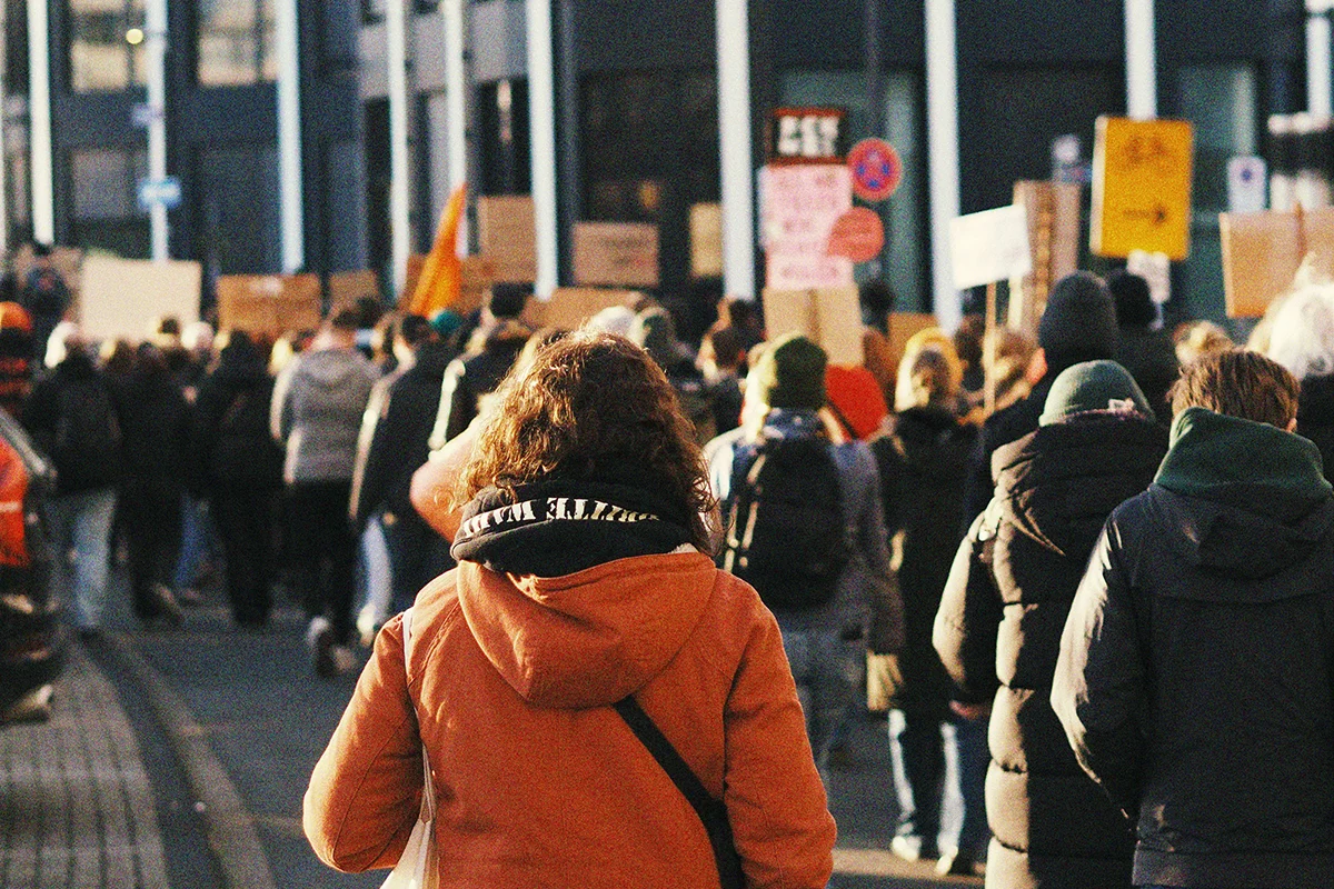 Crowd of protesters outside building