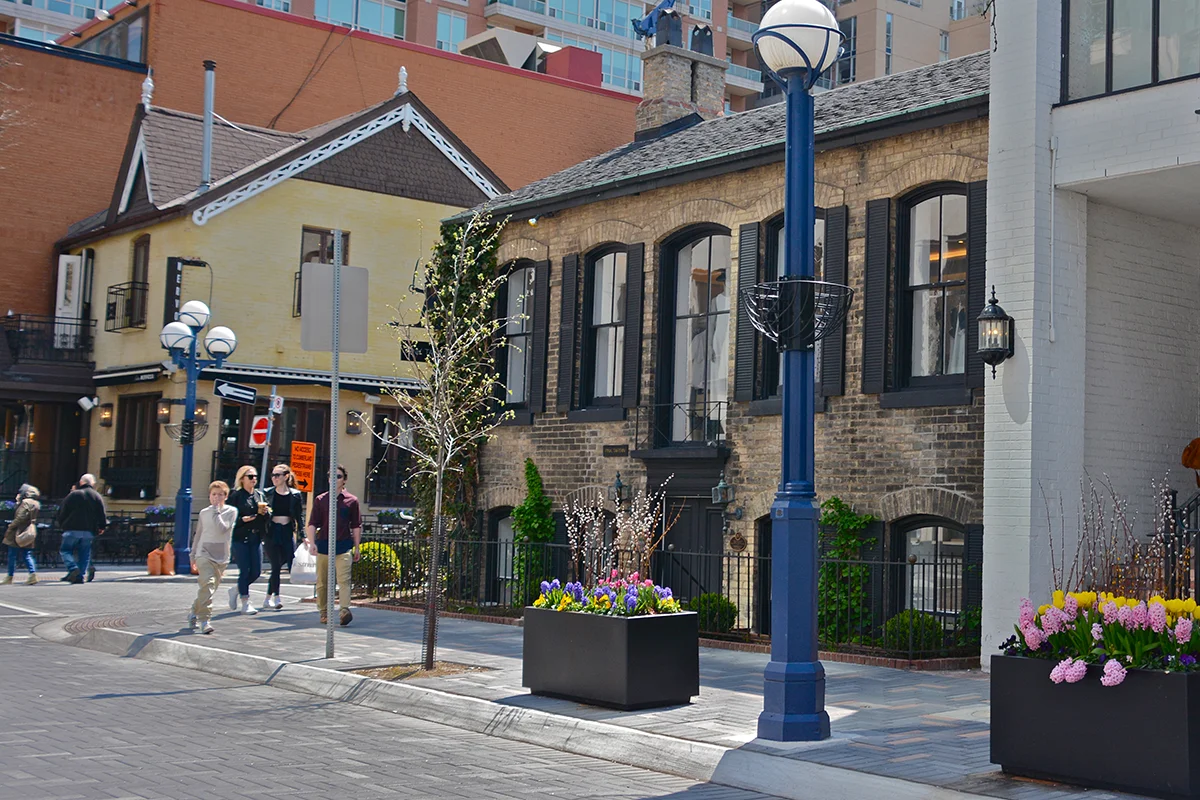 Historic brick 2-storey retail buildings on Yorkville Ave. in Toronto