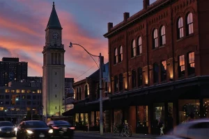 City skyline with clock tower at sunset