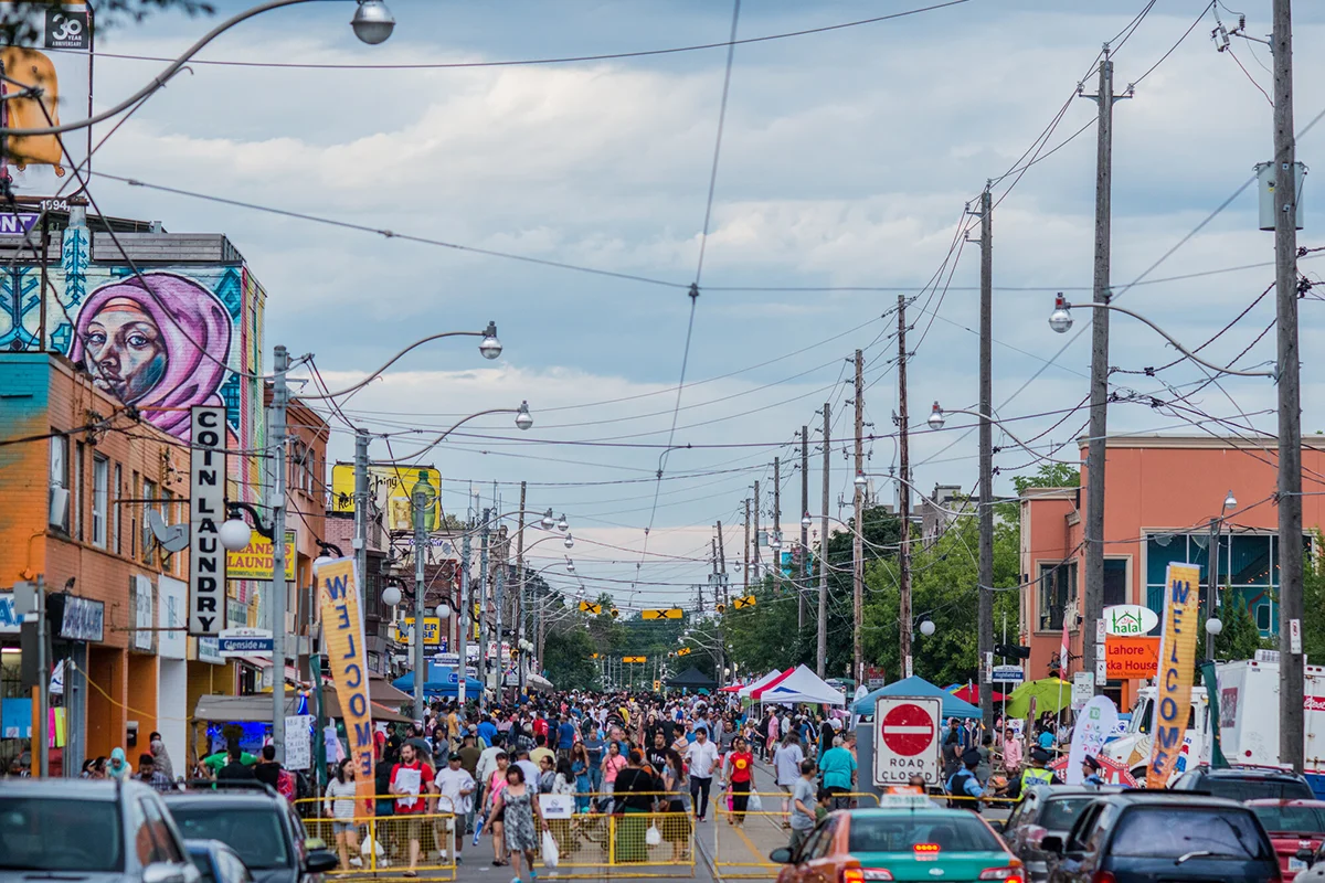 Street closed to traffic and full of pedestrians